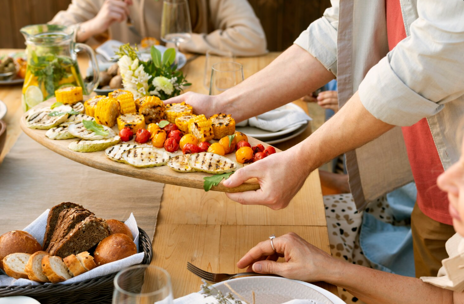 Grilled corn, vegetables, and bread served family-style as part of a southern porch party menu
