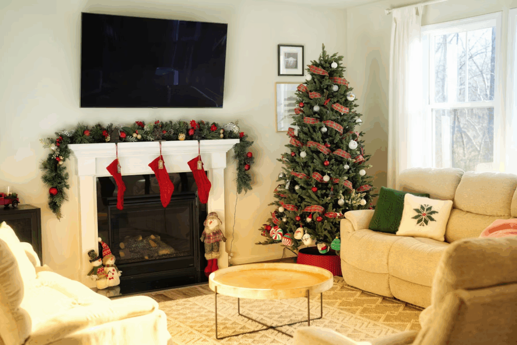 DIY Frame TV art ideas for Christmas with holiday décor, stockings, and a decorated tree
