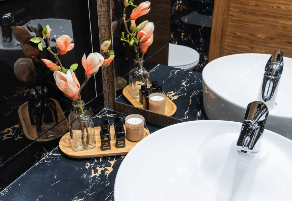 Small bathroom spa design featuring aromatherapy candle and natural accents.