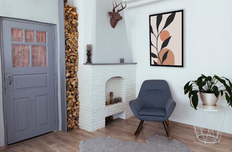 Cozy entryway with a modern chair, indoor plant, and decorative fireplace for a warm first impression.